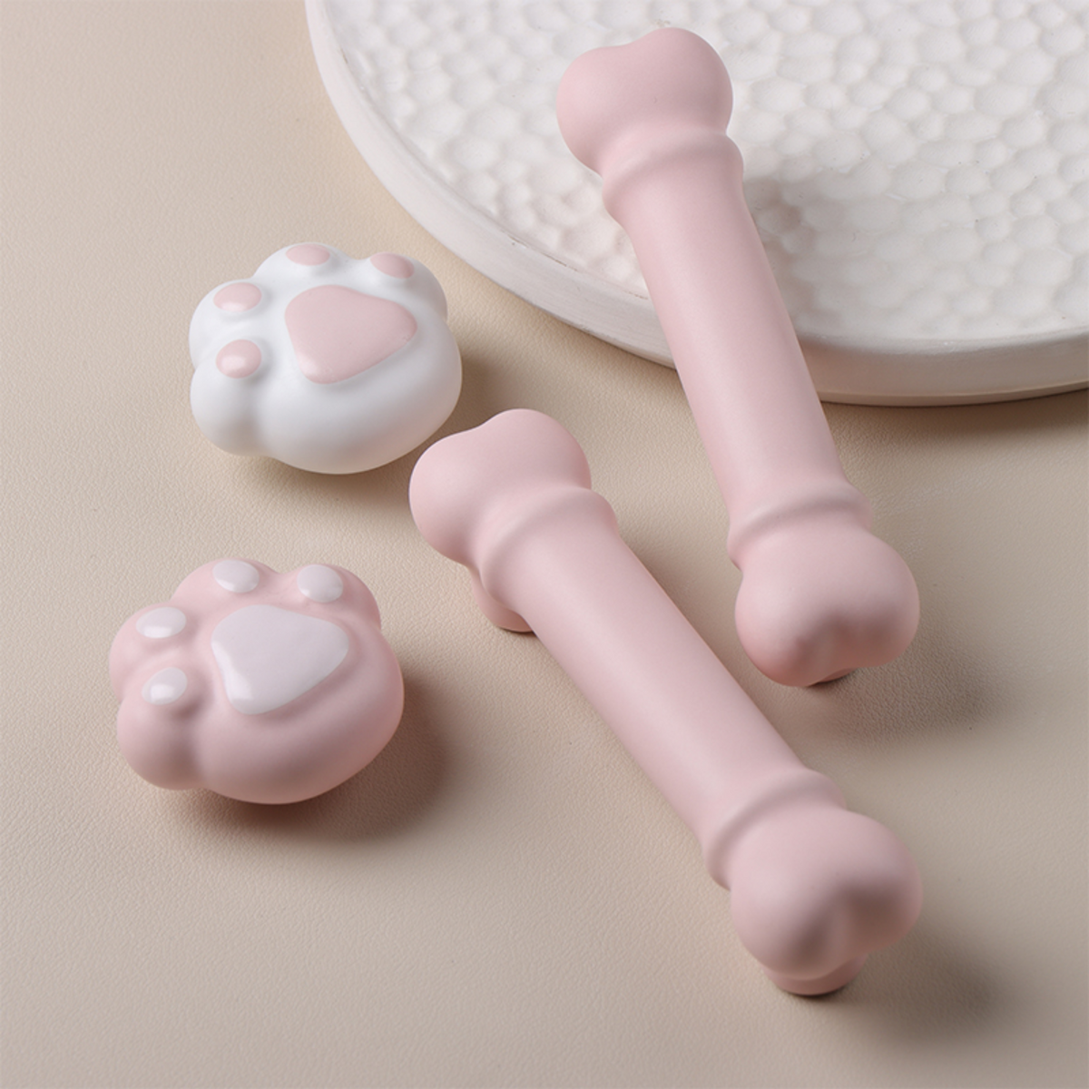 Knobelle pink paw and bone cabinet hardware